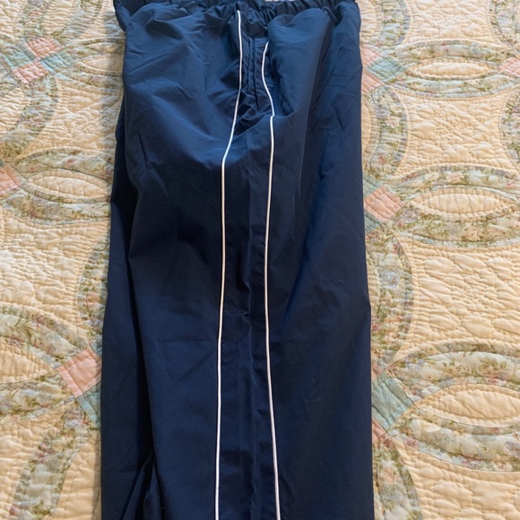 Track pants with white piping, slick material - Picture 4 of 7